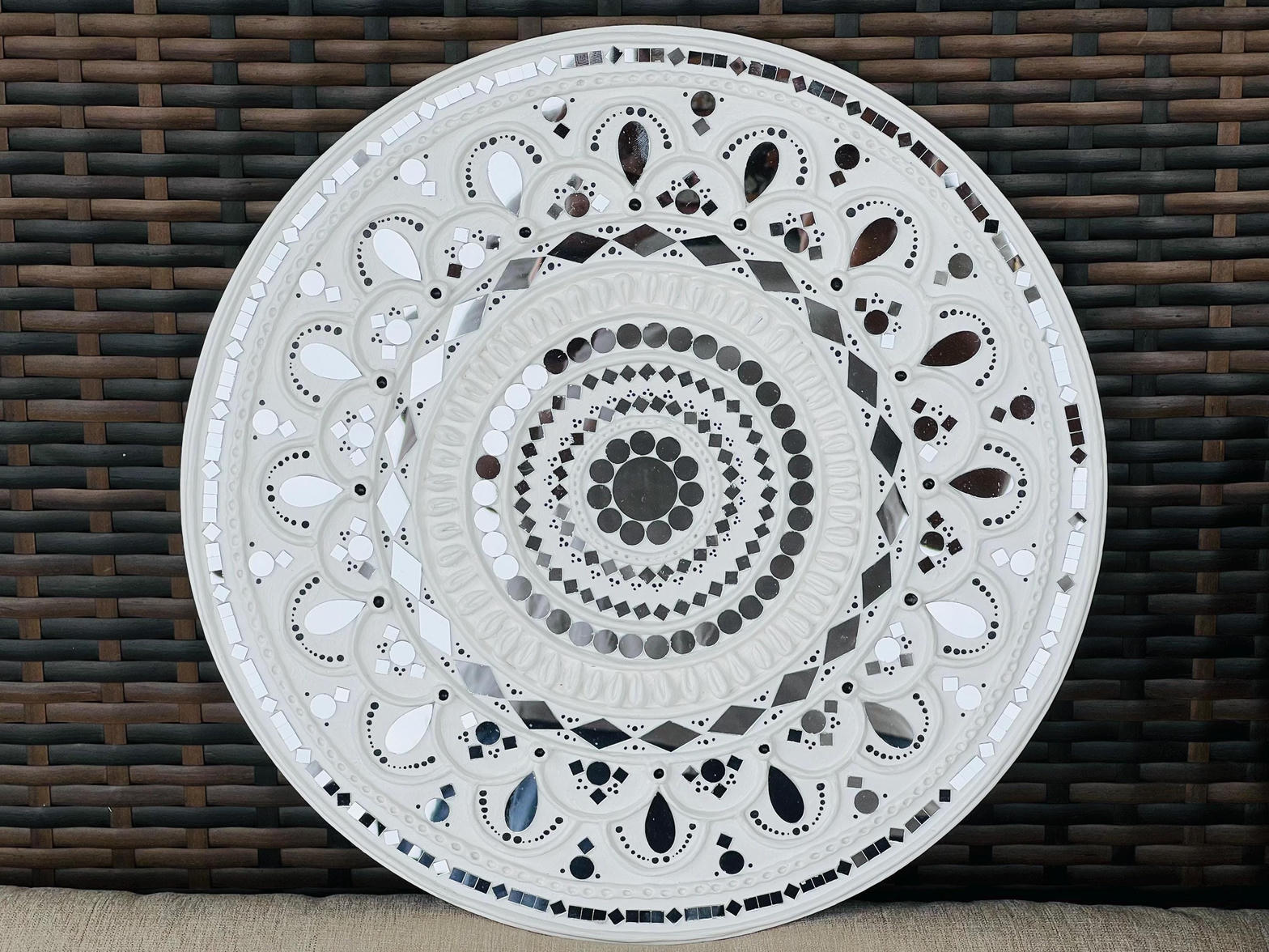 White Lippan circular wall piece with geometric mirror inlay